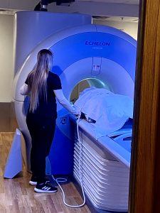 Medical professional assisting patient on MRI